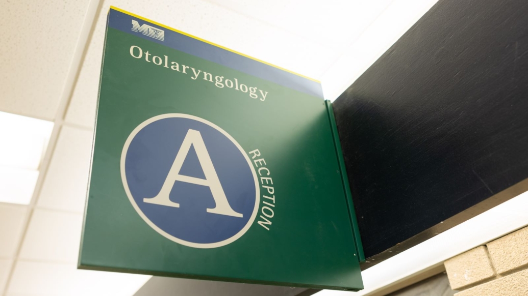 medical sign in green with A symbol on it