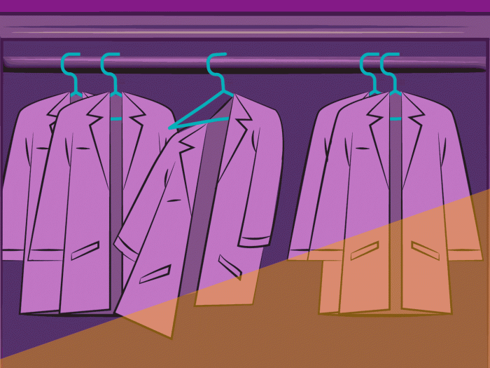 white coats hanging and one swinging off hanger with purple haze over them and sunshine peeking through
