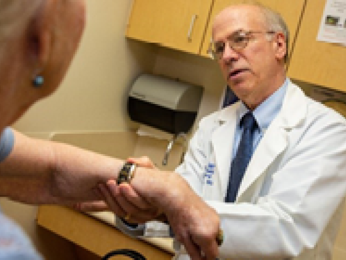 Dr. Holding hand of a patient