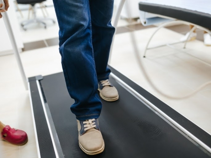 Legs, jeans and shoues treadmill walking