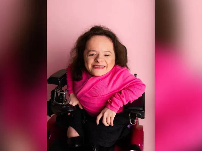 girl in pink shirt in wheelchair