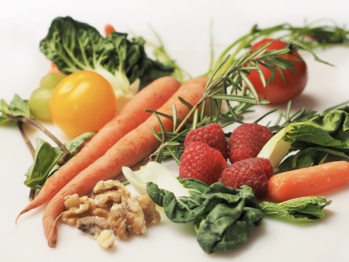 Carrots, Tomatoes, Salads, Berry and nuts photo