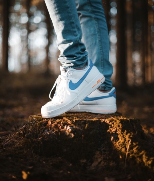 Legs with white tennis on a forest