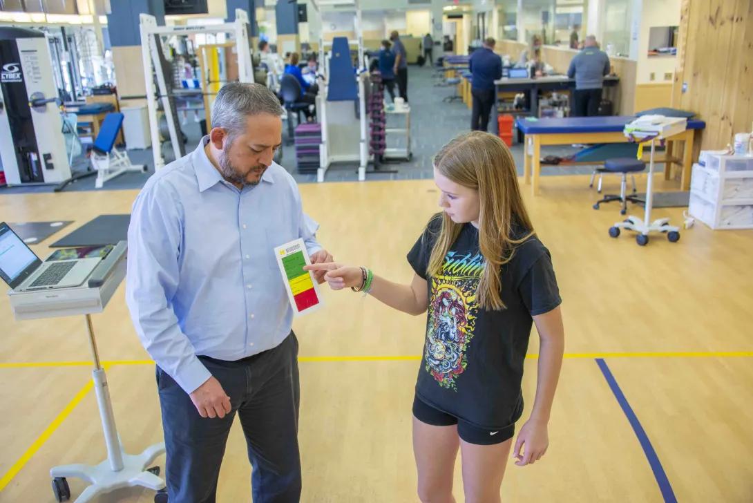 Doctor and young helper test different colors 
