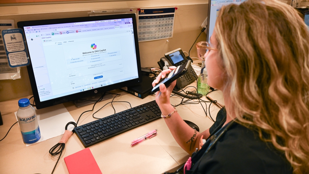 A PA talks into her phone, using DAX AI