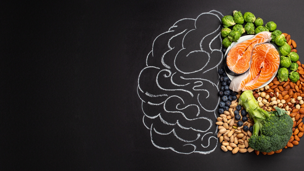 a chalk drawing of a brain with healthy food on one side 