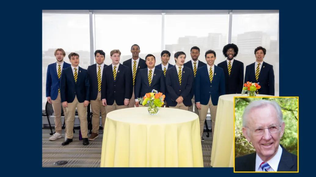 Members of the U-M Men’s Glee Club perform at the Brehm Center Celebration of Life event, with an inset portrait of Bill Brehm displayed in the corner of the image.