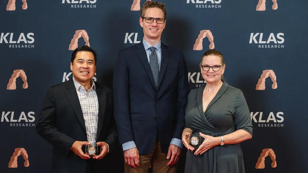 Doctors Rino Bautista, Michael Lanham, and Greta Branford accepting awards at KLAS summit