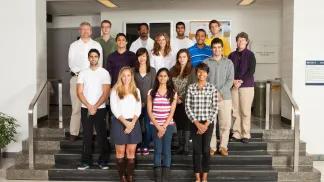 group picture of masters students in hall of MIP building 