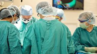 A team of surgeons working together in the operating room