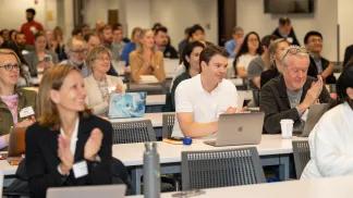 Conference attendees clapping