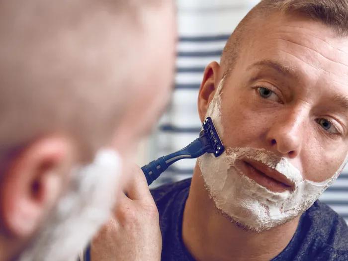 Kade Fitzgerald shaves his face