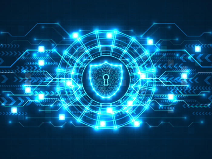 Photo of data being represented by blue code and a shield in the center representing security
