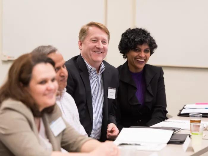 smiling participants in educational seminar