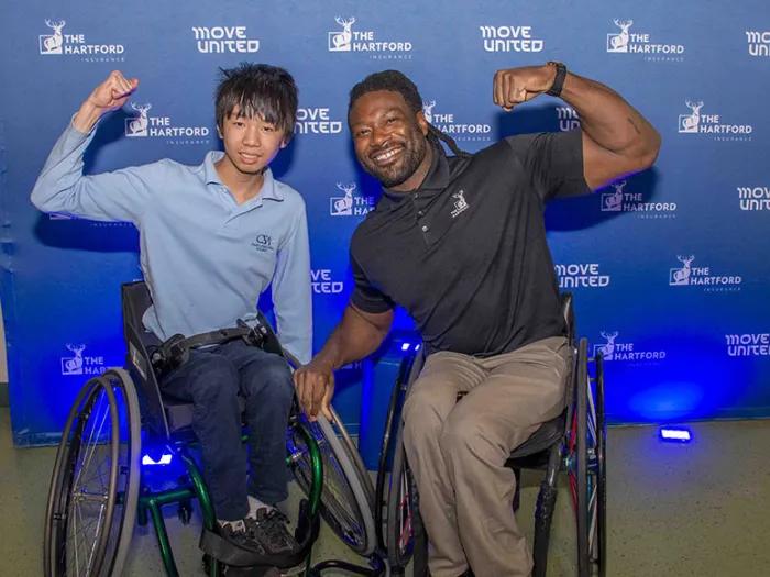 Bryan receives his Quickie wheelchair. Photos by Chris Hedly
