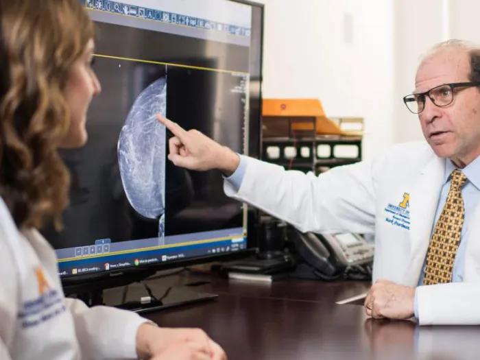 OBGYN faculty member pointing to diagnostic image on screen