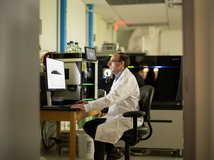 scientist using mass spectrometry technology