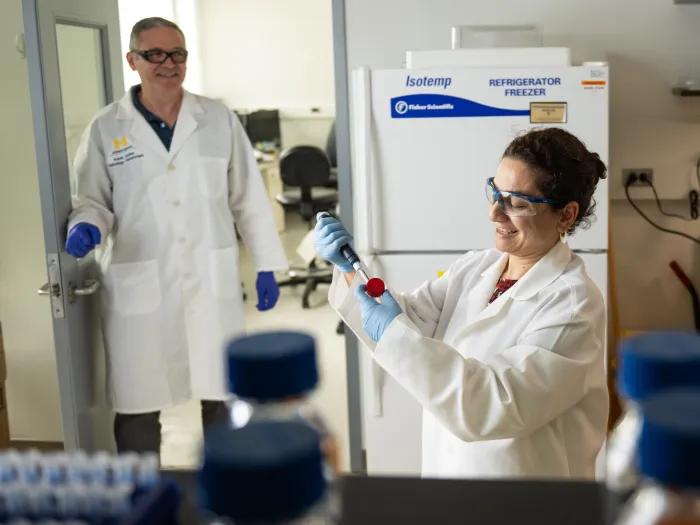 two scientists in the proteomics resource facility
