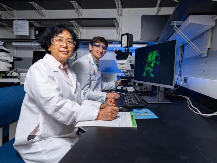 Dr. Prasov and one of his team members in the lab