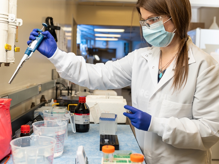 young woman working in lab, retrieving data