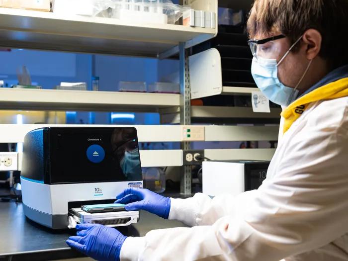 person working in lab with equipment