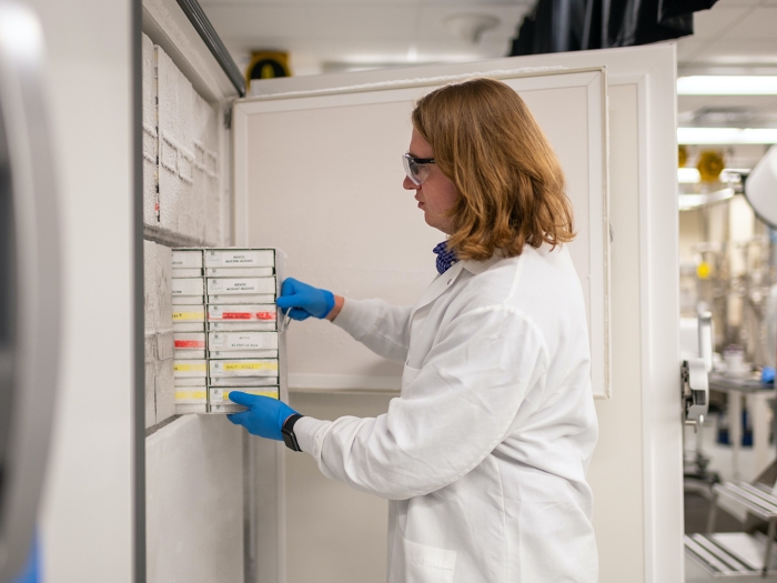 Photo of biospecimen being pulled out of a freezer