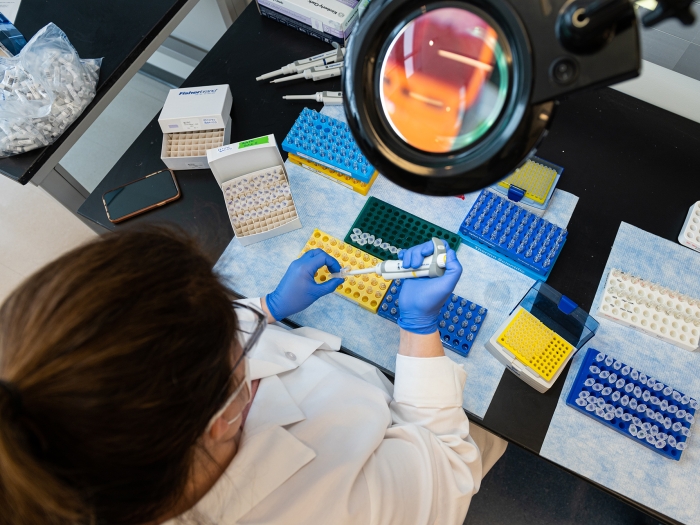 Photo taken from above of a female researcher in the Metabolomics Core