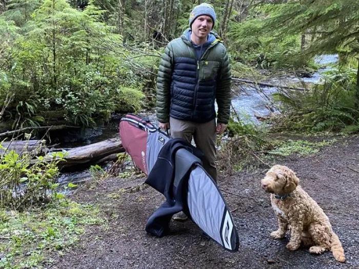 Brandon in the forest with his dog