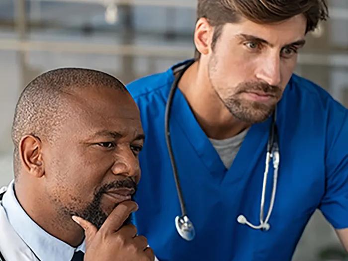 Doctors looking at the computer screen.