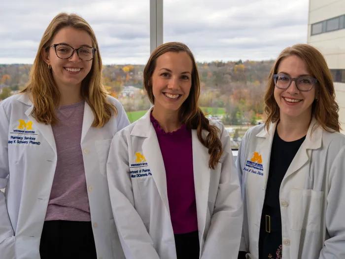 three pharmacists smiling 