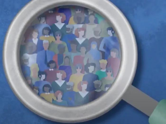 Magnifying glass with diverse set of people images inside