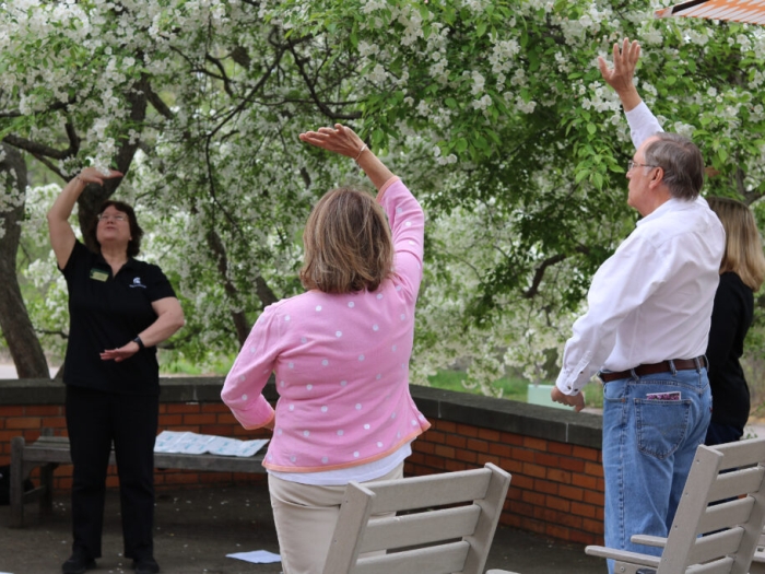 Caregivers practicing tai chi at the Caregiver Wellness Day retreat. 