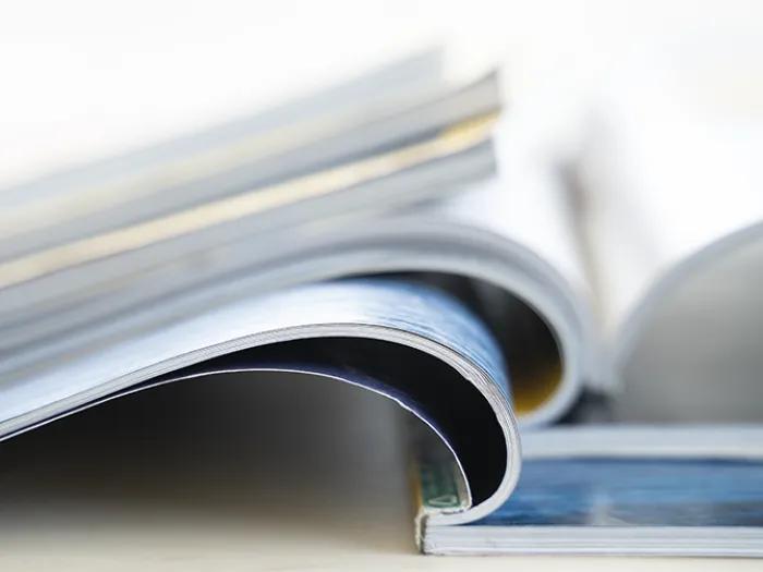 Pile of open and closed magazines