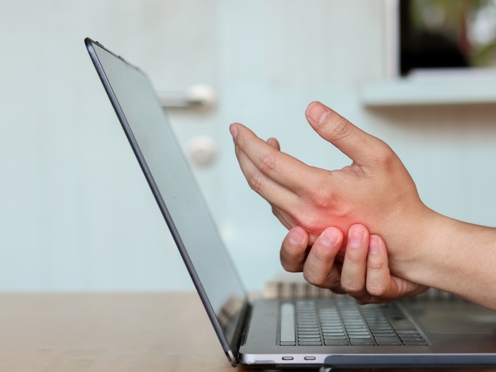 laptop and hand in pain red in hand