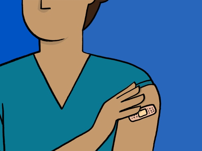 person holding arm with band aid teal shirt