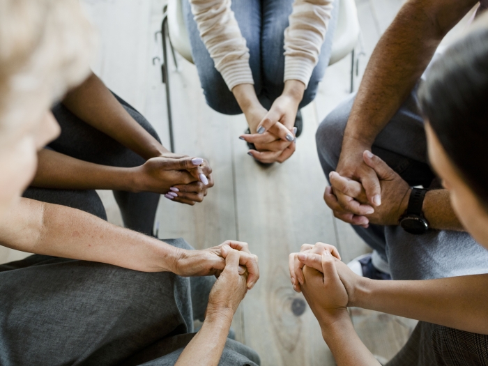 group of hands in a circle 