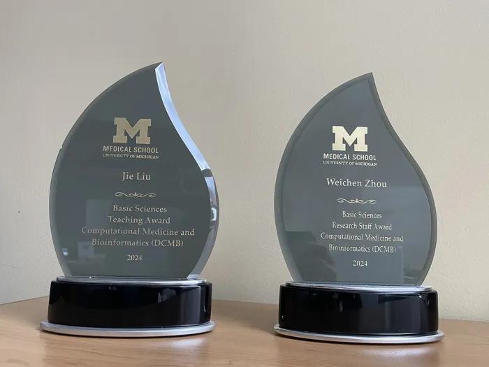 EBS award trophees, engraved with professor Jie Liu and professor Weichen (Arthur) Zhou's names
