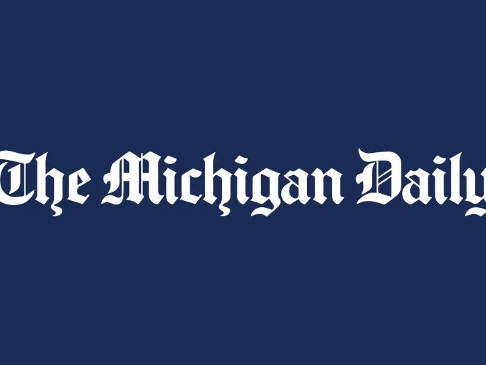 The Michigan Daily logo on a dark blue background.