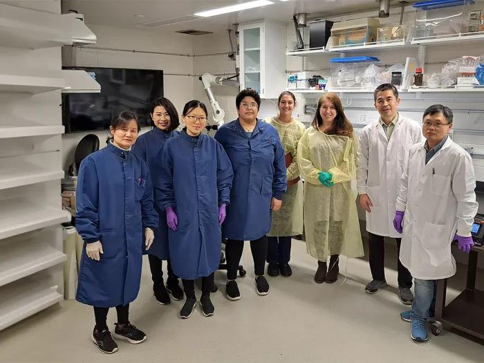personnel posing for a photo in the mmpc-live lab