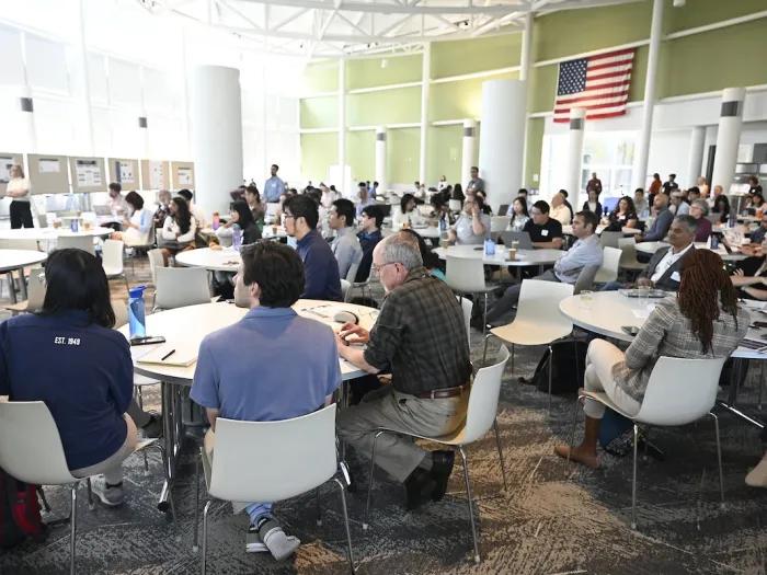 eHail members sitting at table in a conference room