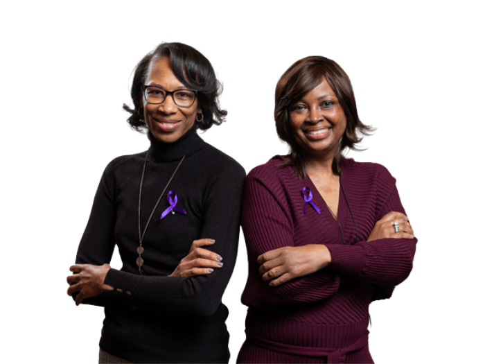 Two Lupus Survivors smile facing the camera