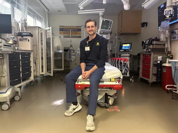 Taylor Krupp sitting on a hospital bed
