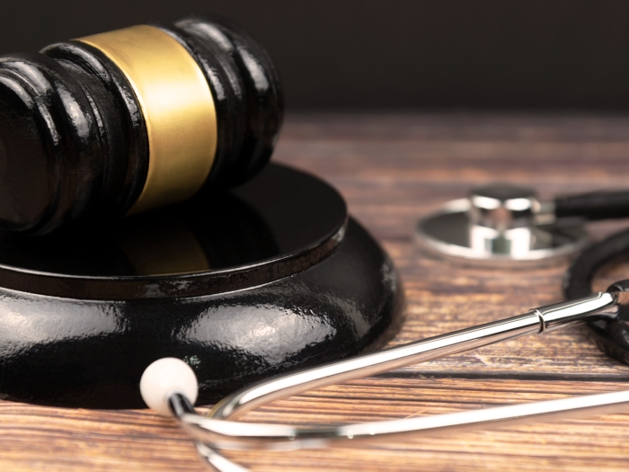 stethoscope close up black and wood table