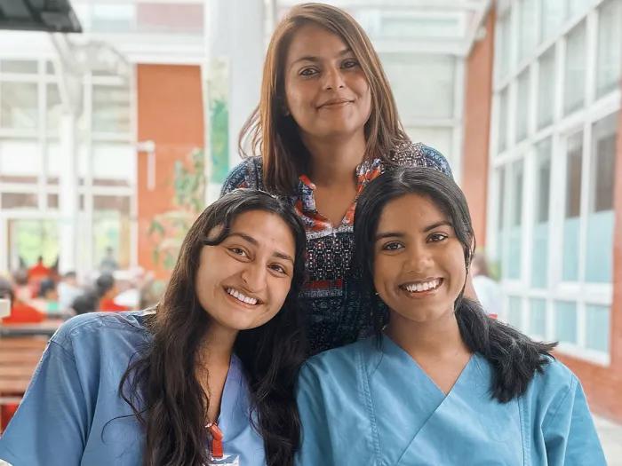 two medical students with their Nepal collaborator