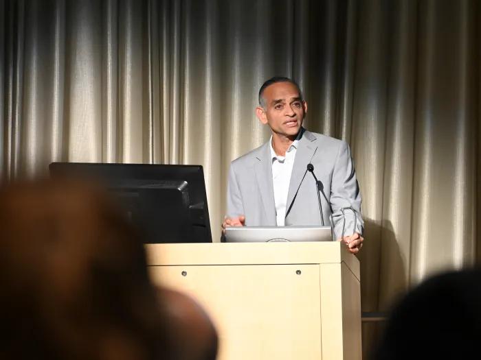 Dr. Prashant Mahajan speaks at a podium
