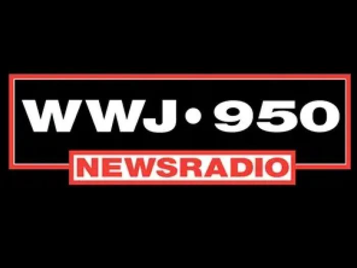 logo for WWJ Newsradio 950 in white and red on a black background