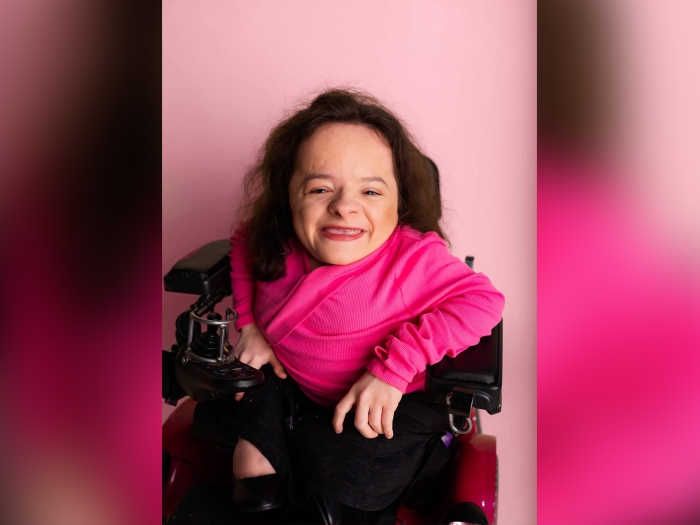girl in pink shirt in wheelchair