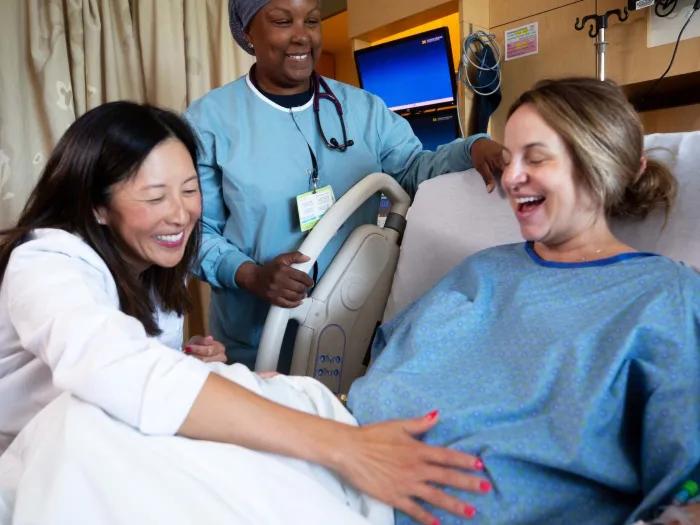Doctor, Nurse, and Patient in Delivery Bed