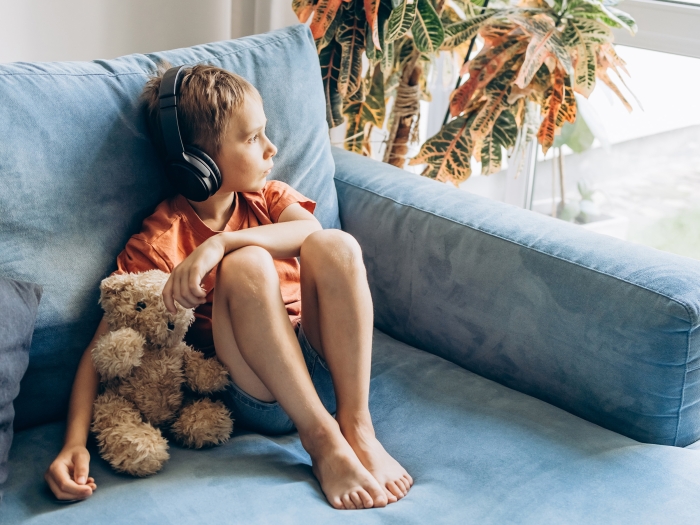 boy sitting listening to headphones