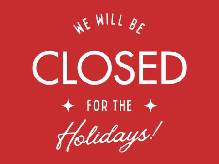Image of white text that says we will be closed for the holidays on a red background